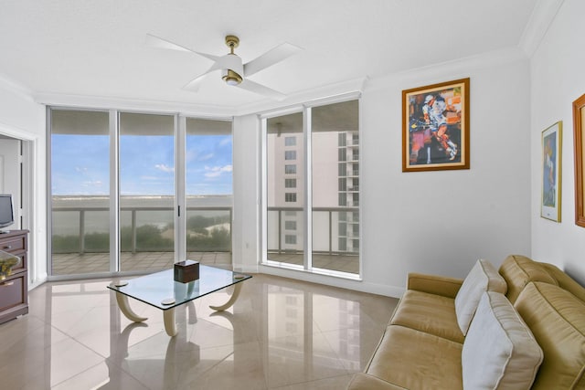 living room with ceiling fan, floor to ceiling windows, light tile patterned floors, and ornamental molding