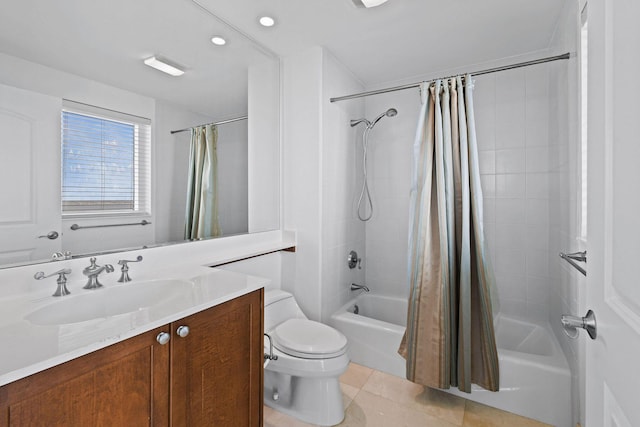 full bathroom featuring tile patterned floors, vanity, toilet, and shower / tub combo with curtain