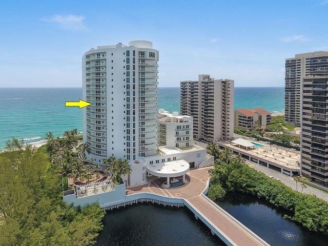 birds eye view of property with a water view