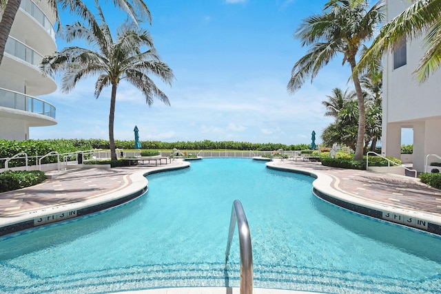 view of swimming pool with a patio