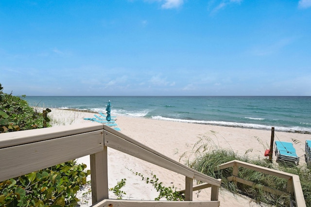 property view of water featuring a beach view