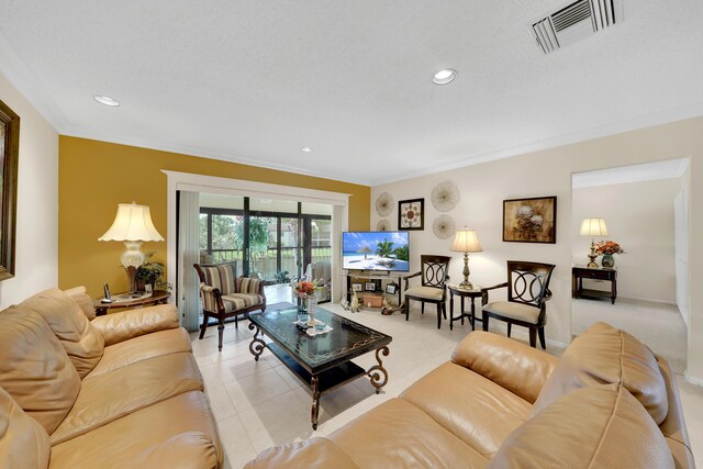 living room with a textured ceiling and crown molding