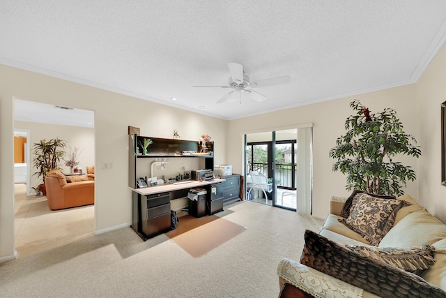 office area featuring ceiling fan, light colored carpet, a textured ceiling, and ornamental molding