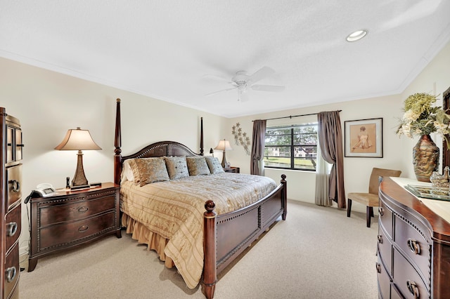 bedroom with ceiling fan, light colored carpet, and crown molding