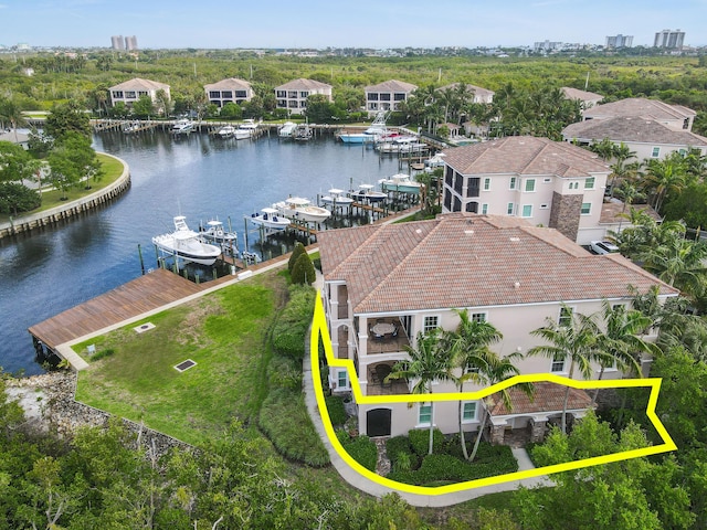 birds eye view of property with a water view