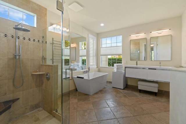 bathroom featuring vanity and plus walk in shower