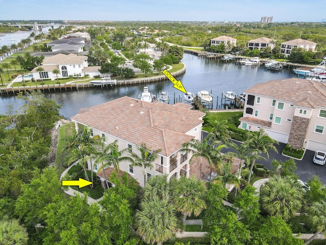 birds eye view of property with a water view