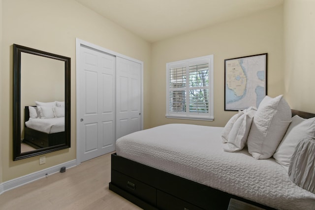 bedroom featuring a closet and light hardwood / wood-style flooring