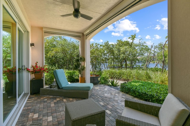 sunroom / solarium with ceiling fan