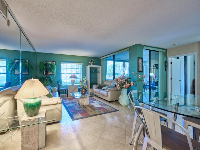 living room featuring a textured ceiling and light tile patterned flooring