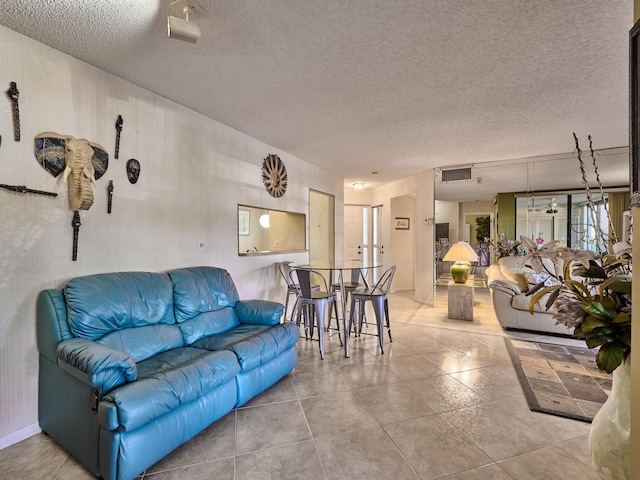 living room with a textured ceiling