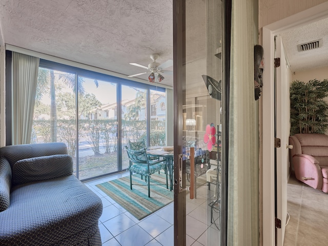 sunroom / solarium with ceiling fan and plenty of natural light