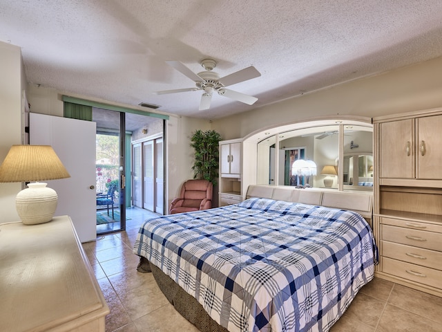 tiled bedroom with a textured ceiling, access to outside, and ceiling fan