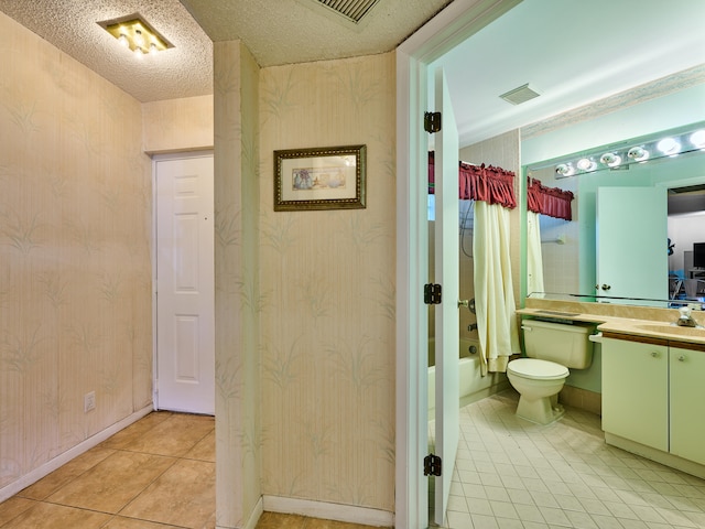 full bathroom with shower / bath combo, toilet, tile patterned flooring, a textured ceiling, and vanity