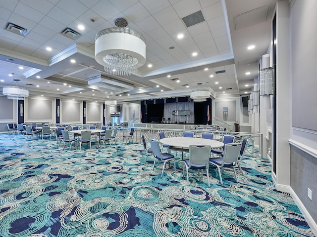 dining room featuring coffered ceiling, ornamental molding, and carpet