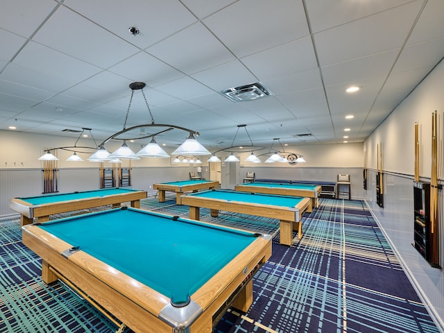 recreation room featuring a paneled ceiling, pool table, and dark carpet