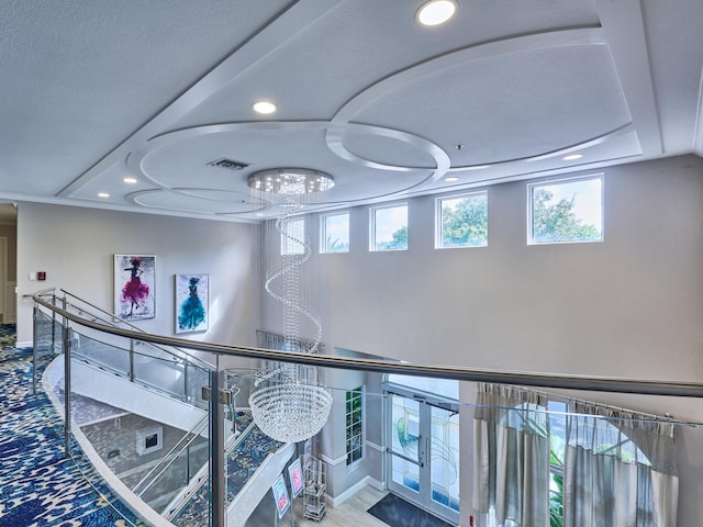 hallway featuring an inviting chandelier