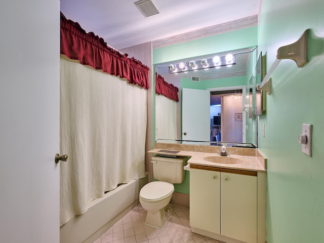 full bathroom with toilet, shower / bath combo, vanity, and tile patterned flooring