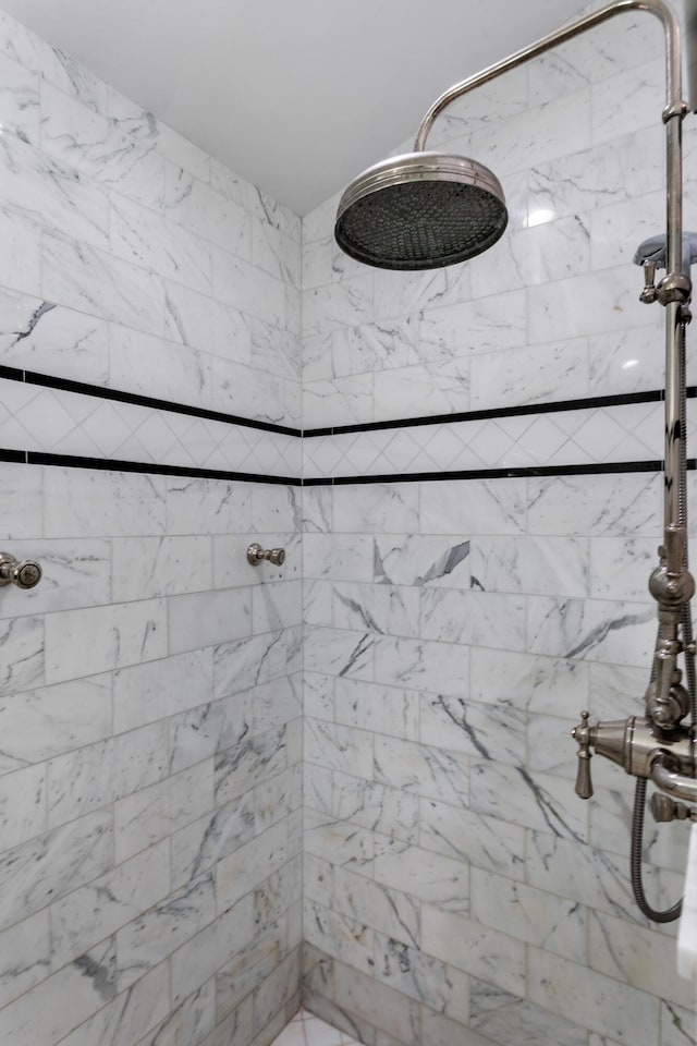 bathroom with tiled shower