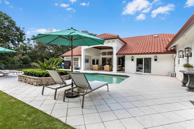 view of pool featuring a patio