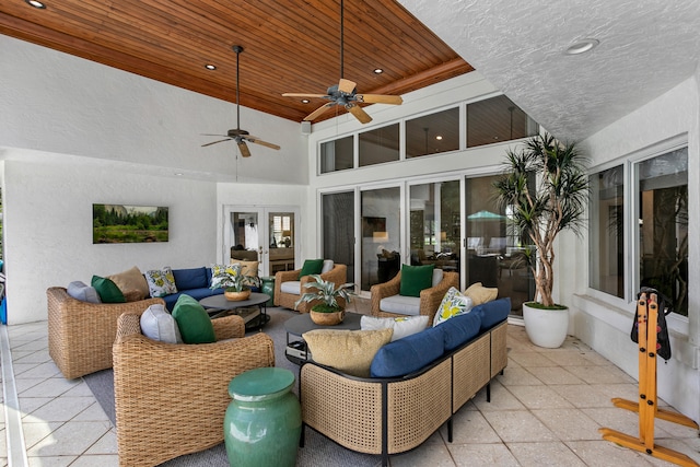 view of patio with outdoor lounge area and ceiling fan