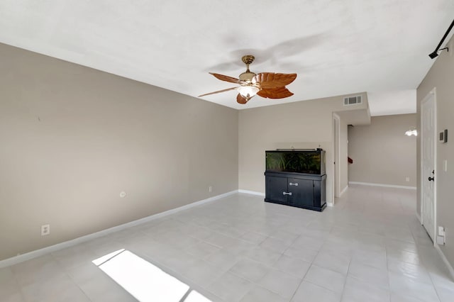 unfurnished living room with ceiling fan and light tile patterned floors