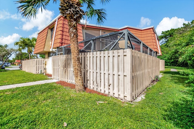 view of home's exterior with a lawn