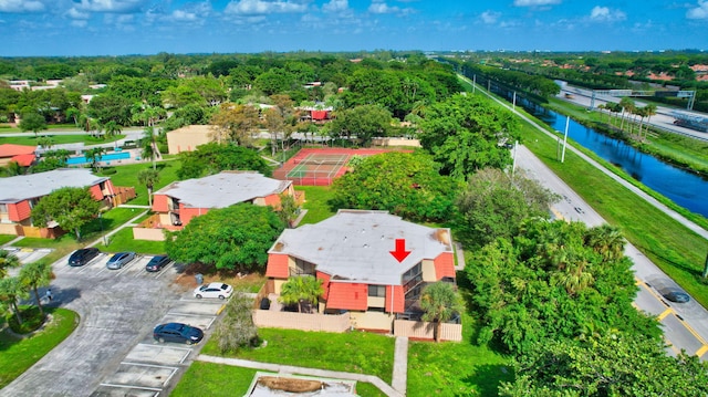 birds eye view of property with a water view