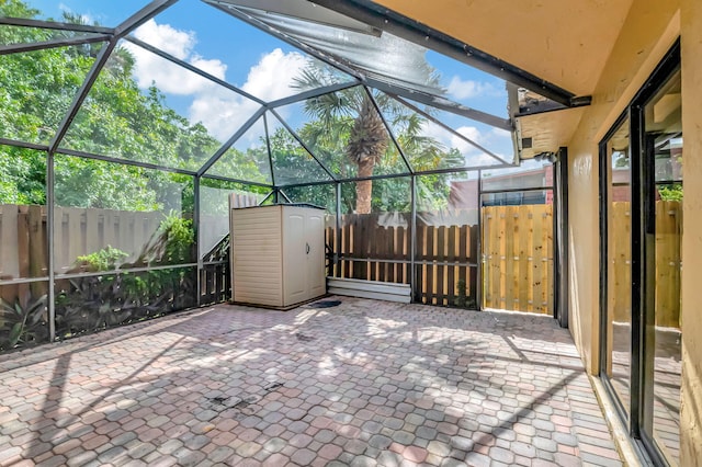 view of patio / terrace with a storage unit and glass enclosure