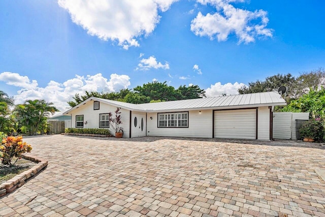 single story home with a garage