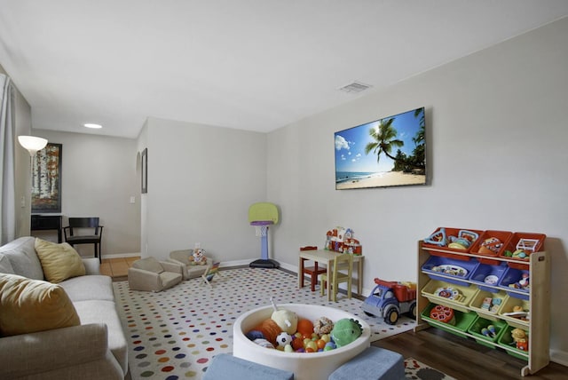 game room featuring baseboards, visible vents, and recessed lighting
