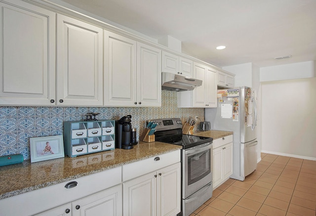 kitchen featuring stone counters, backsplash, white cabinetry, stainless steel appliances, and light tile patterned floors