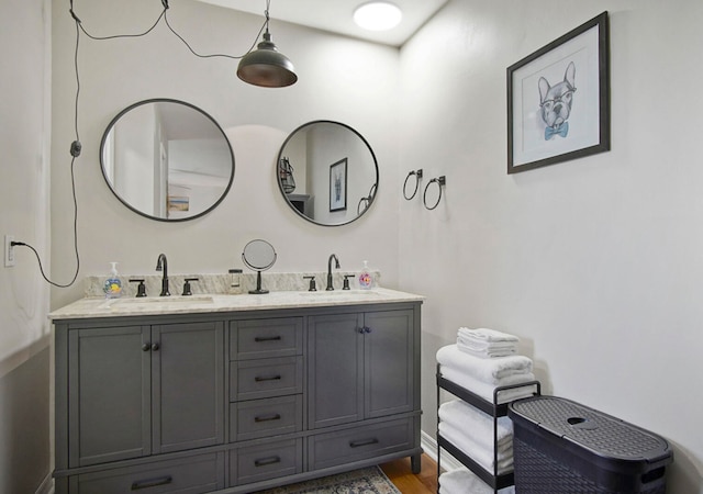 bathroom featuring vanity and hardwood / wood-style flooring