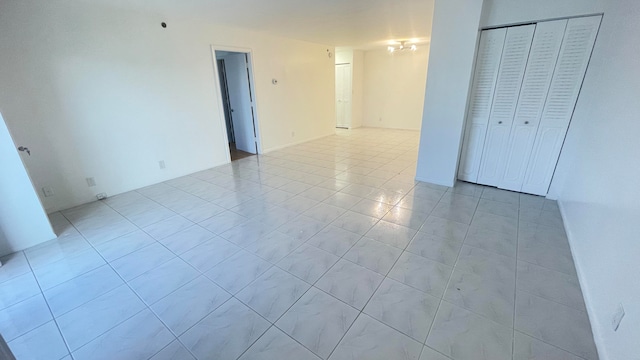 empty room with light tile patterned floors