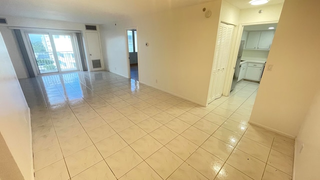 empty room with light tile patterned floors