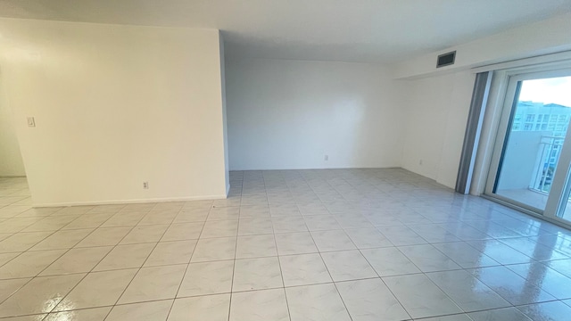 empty room with light tile patterned floors