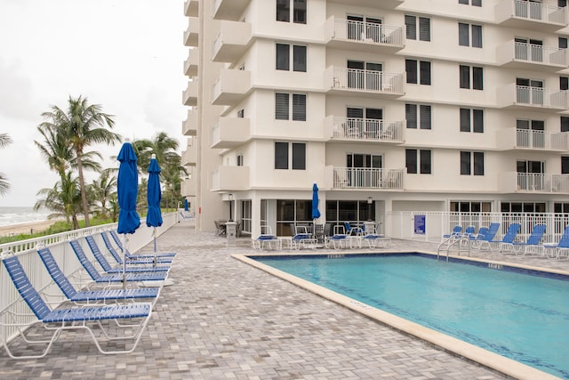 view of swimming pool with a patio