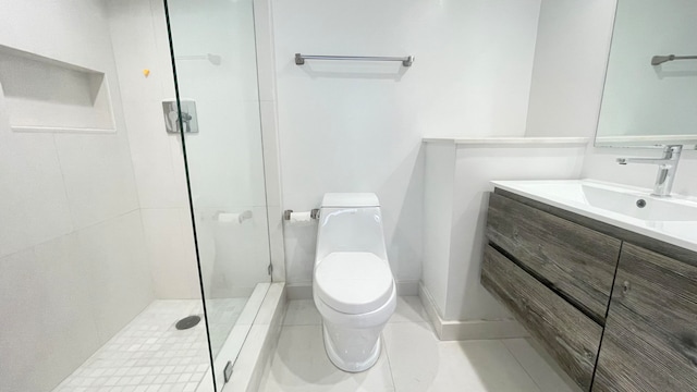 bathroom featuring vanity, toilet, a shower with shower door, and tile patterned flooring