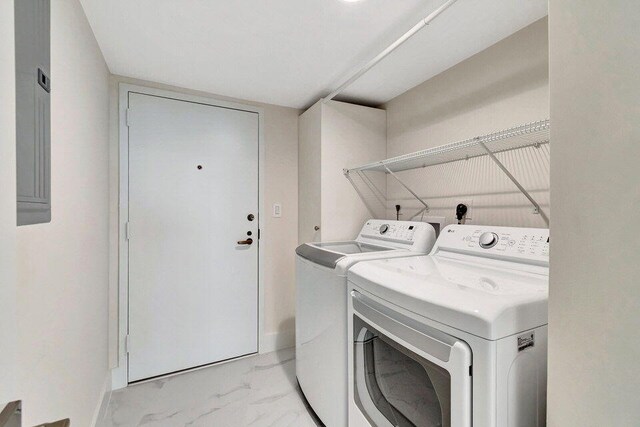 washroom with washing machine and clothes dryer