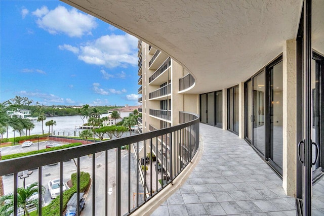 balcony featuring a water view