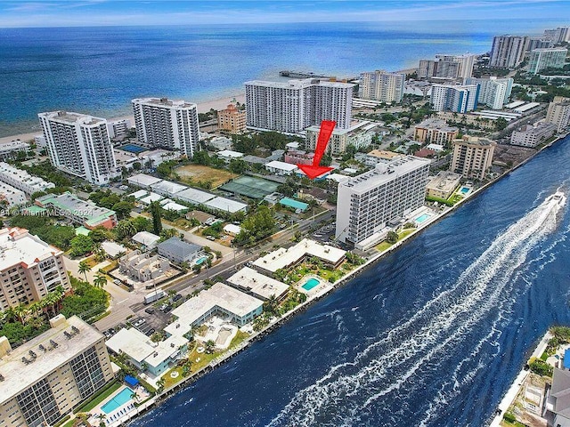 birds eye view of property with a water view