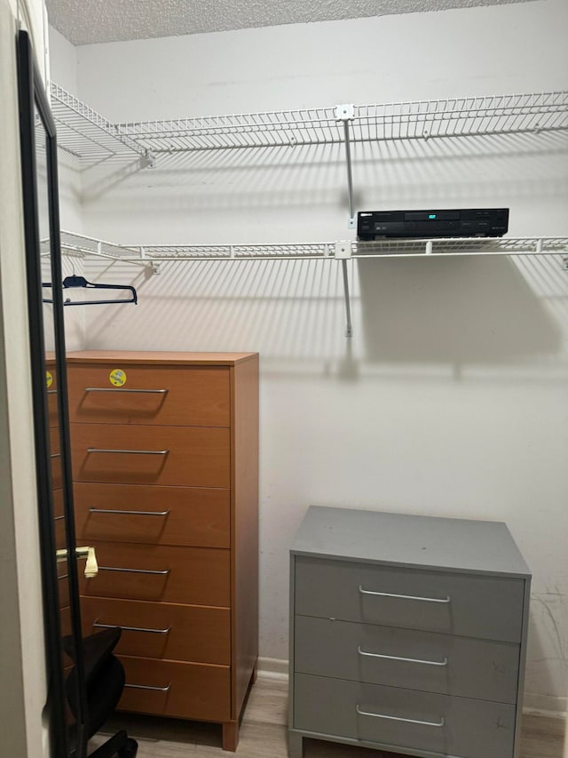 walk in closet featuring hardwood / wood-style floors