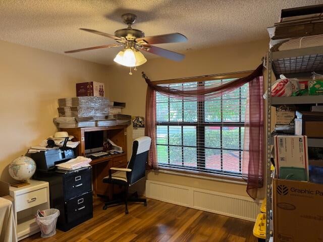 office area featuring a textured ceiling, dark hardwood / wood-style flooring, and ceiling fan