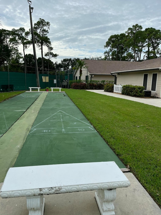 view of home's community featuring a yard