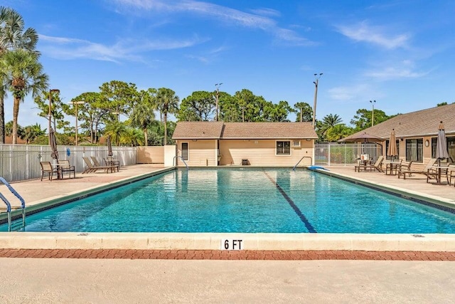 view of swimming pool with a patio area