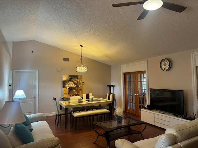 living room with a textured ceiling, ceiling fan, dark hardwood / wood-style flooring, and lofted ceiling