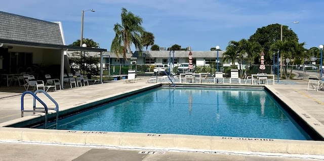 view of pool featuring a patio area