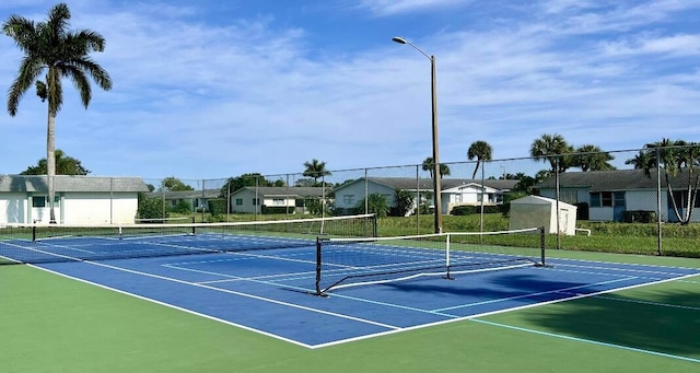 view of sport court with basketball hoop