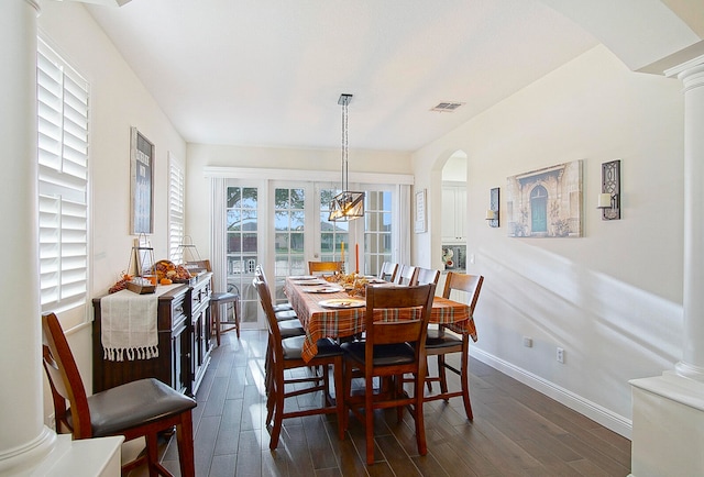 dining room with a notable chandelier and dark hardwood / wood-style floors