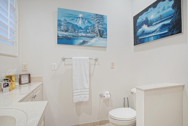 bathroom with vanity and toilet